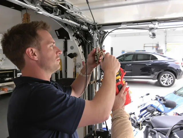 New Milford Garage Door Repair safety certified technician performing cable replacement in New Milford