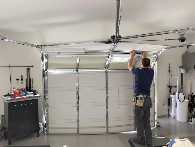 New Milford Garage Door Repair specialist performing precise section replacement on New Milford garage door