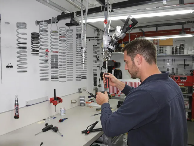 New Milford Garage Door Repair safety certified technician performing precision spring replacement in New Milford